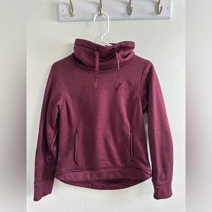 Maroon Northface sweatshirt.